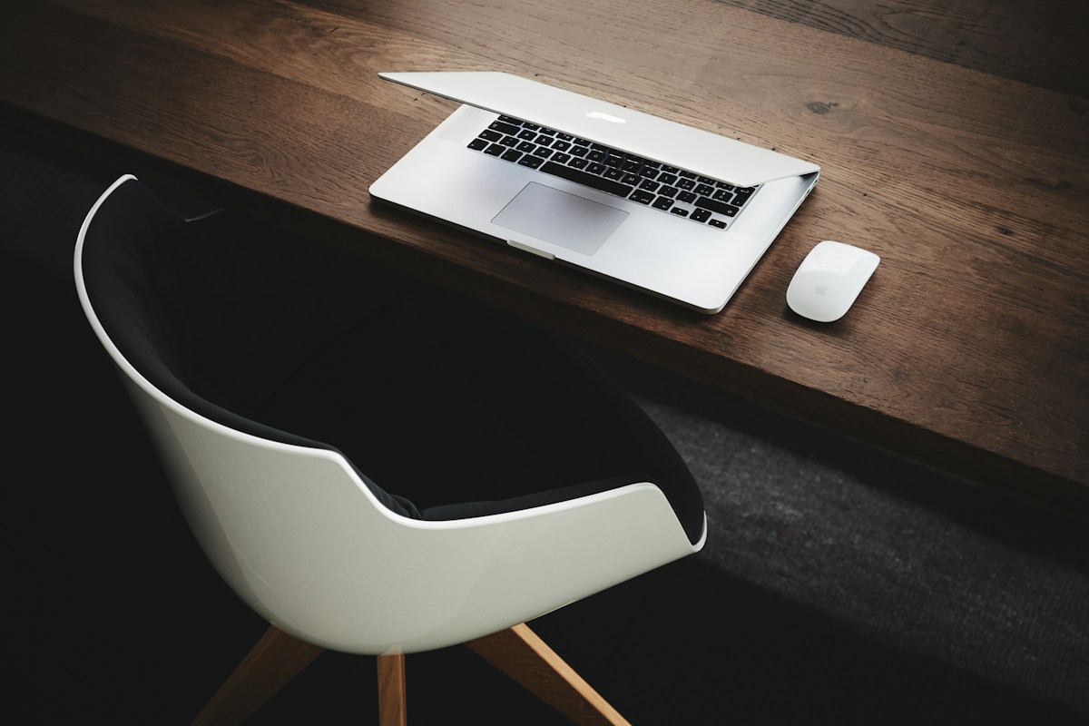Laptop and mobile devices arranged on a bright modern desk