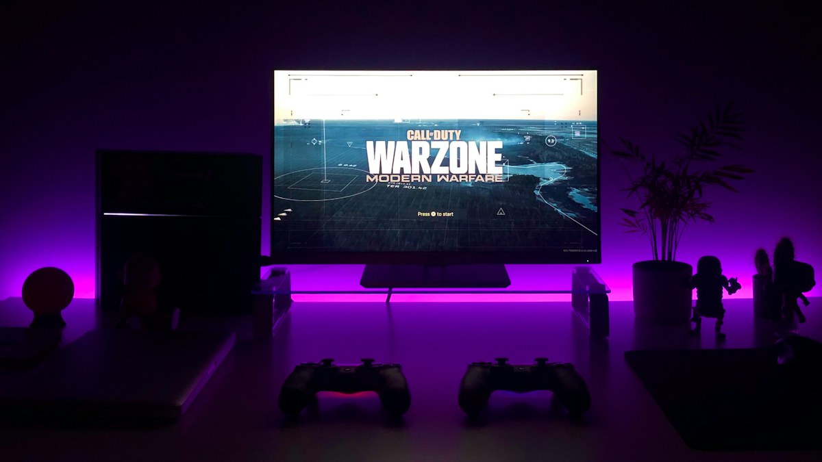 Gaming controller in front of a desktop gaming setup